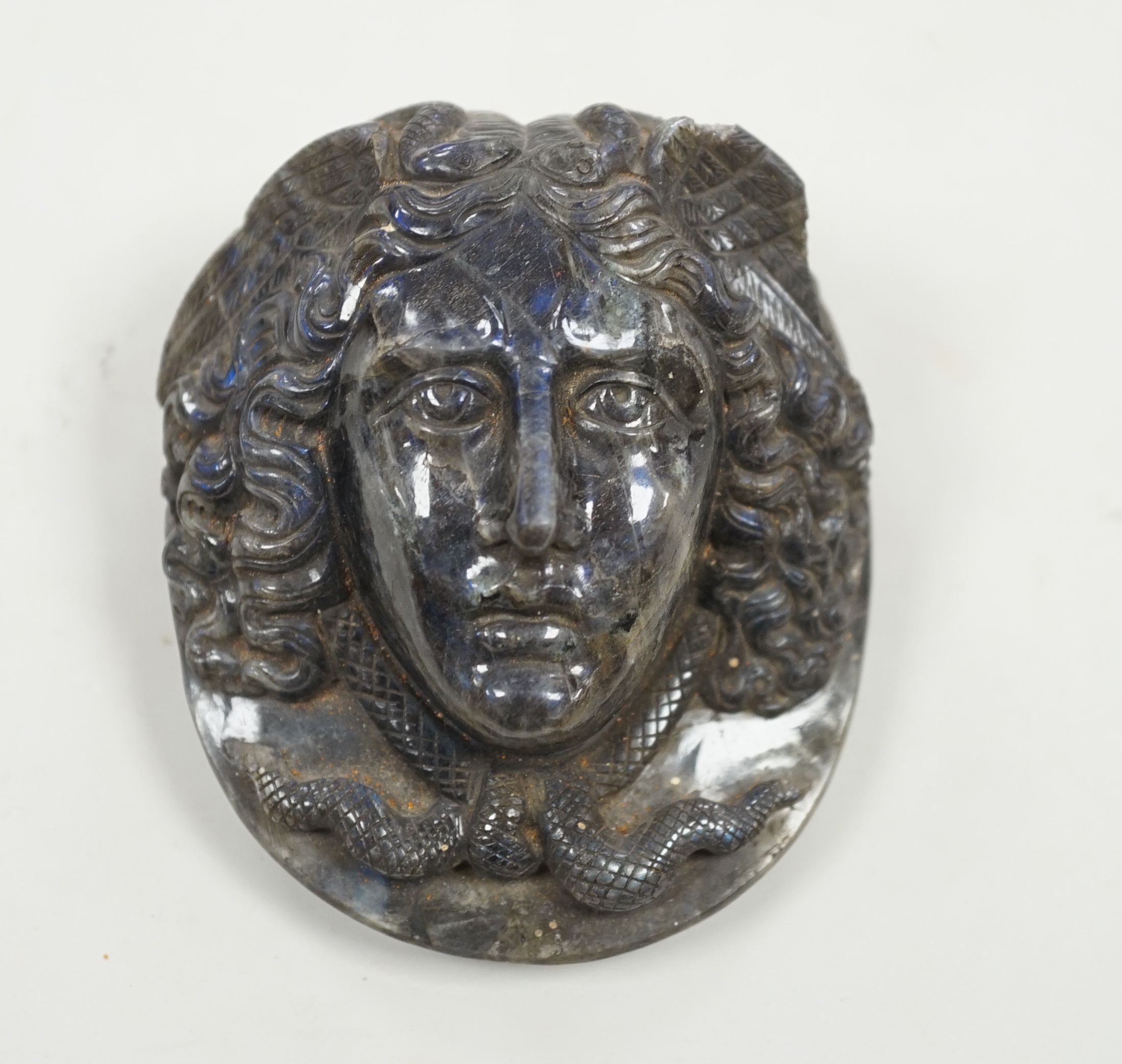 A carved labradorite paperweight with the head of Medusa, After the Antique, 8cm